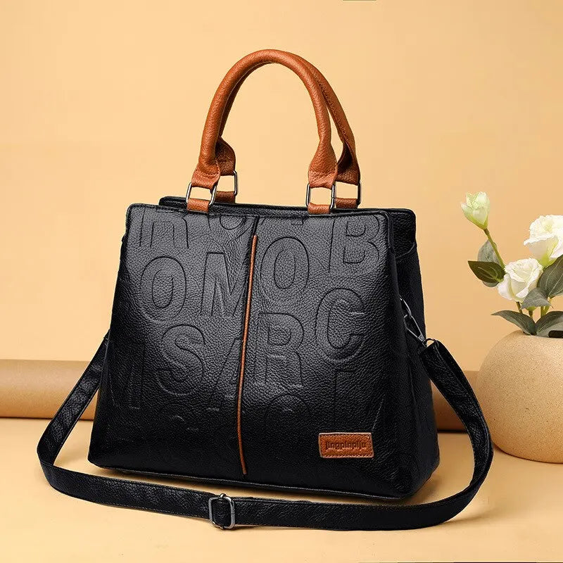 2023 New Fashion Solid Color Shoulder Large Capacity Soft Leather Cloth Letter Embossed Ladies Handbag